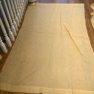 Pair of sheer drapery panels, textured gold fabric